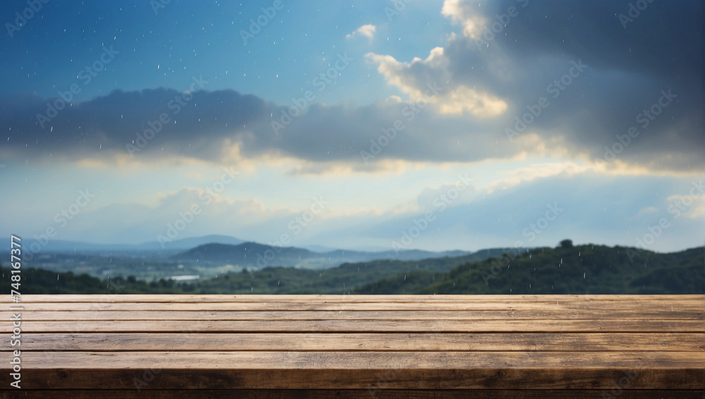 Empty wooden table for product display with a background of sky during rain