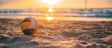 Volleyball ball on the beach in the sunset light. Selective focus. Vacation Concept. Sport Concept with Copy Space. Beach Volleyball.