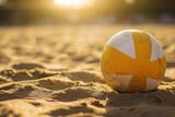 Volleyball ball on the beach with the sun in the background. Vacation Concept. Sport Concept with Copy Space. Beach Volleyball.