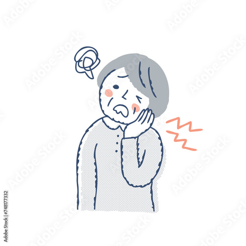 歯が痛くて困っているシニア女性