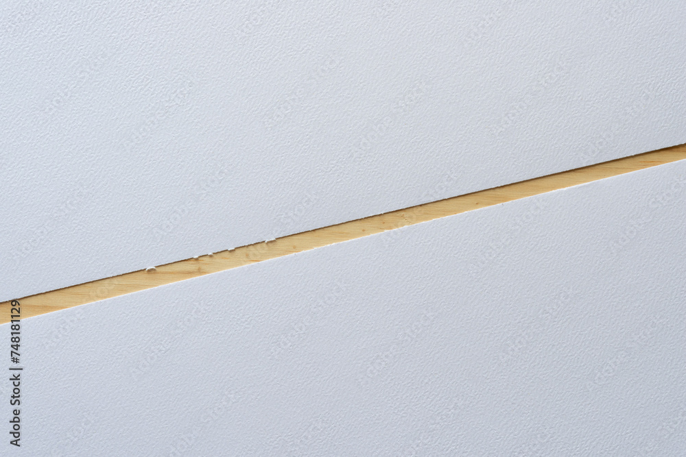 two sheets of textured paper (tear-off edge) on wood two sheets of textured paper (tear-off edge) on wood