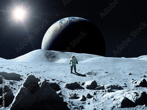 Moon surface with cosmonaut in the background of Earth. Elements of this image furnished by NASA. photo