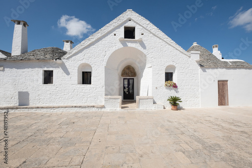 Front view of the sovereign trullo, one of the oldest and most famous buildings of the city of alberobello Puglia, Italy