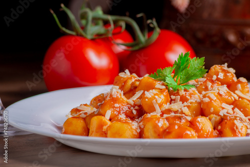 Gnocchi dish with sauce and wine