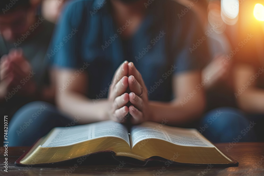 Christian group praying to God with the bible and spreading the gospel. Concept of faith in God - obrazy, fototapety, plakaty 