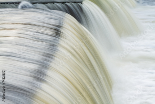 Landscape captured with motion blur of a cascade on the Rabbit River, Michigan, USA