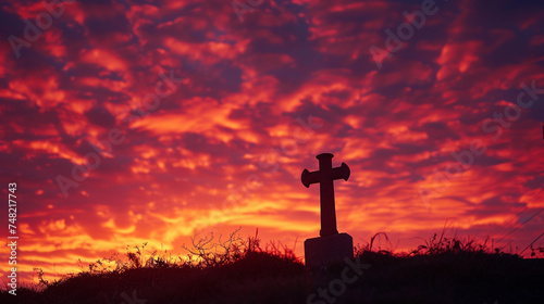 A fiery sunset creating a dramatic backdrop for a silhouette of a cross, reflecting the power and passion of faith