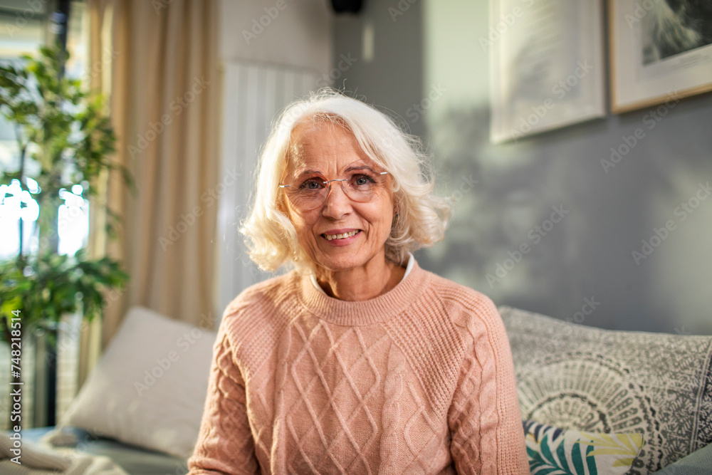 Smiling portrait of a elderly woman at home