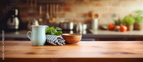 A wooden table is displayed with various dishes and a pitcher placed neatly on top. The setting is simple yet elegant, showcasing a selection of kitchenware.