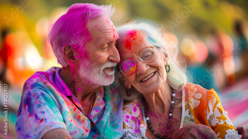 Joyful senior couple celebrating holi festival