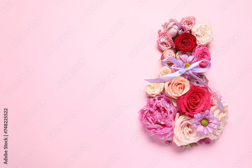8 March greeting card design made with beautiful flowers on pink background, top view. Space for text 8 March greeting card design made with beautiful flowers on pink background, top view. Space for text