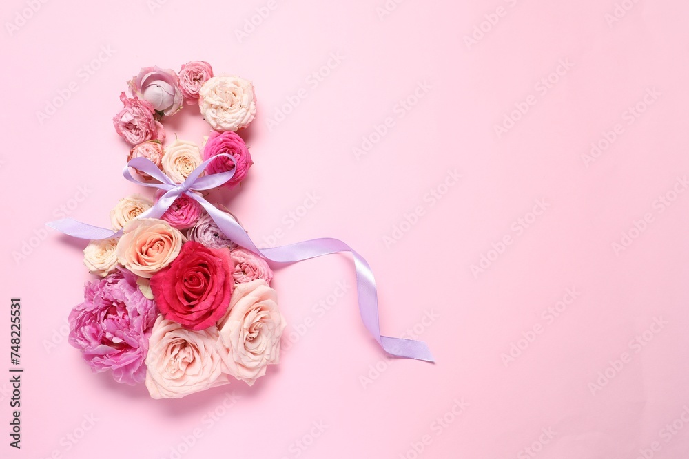 8 March greeting card design made with beautiful flowers on pink background, top view. Space for text