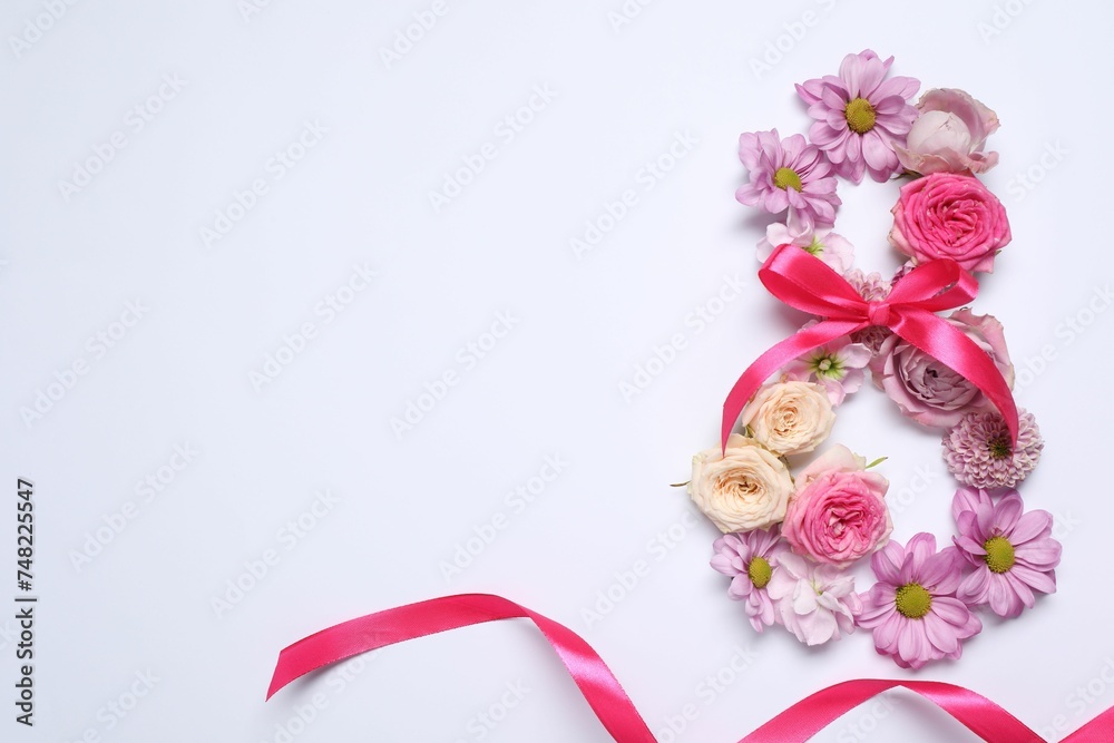 8 March greeting card design made with beautiful flowers on white background, top view. Space for text 8 March greeting card design made with beautiful flowers on white background, top view. Space for text