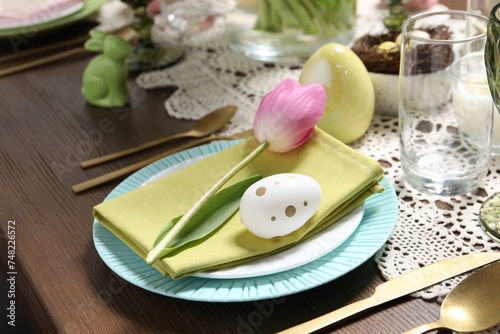 Festive table setting with beautiful tulip, closeup. Easter celebration