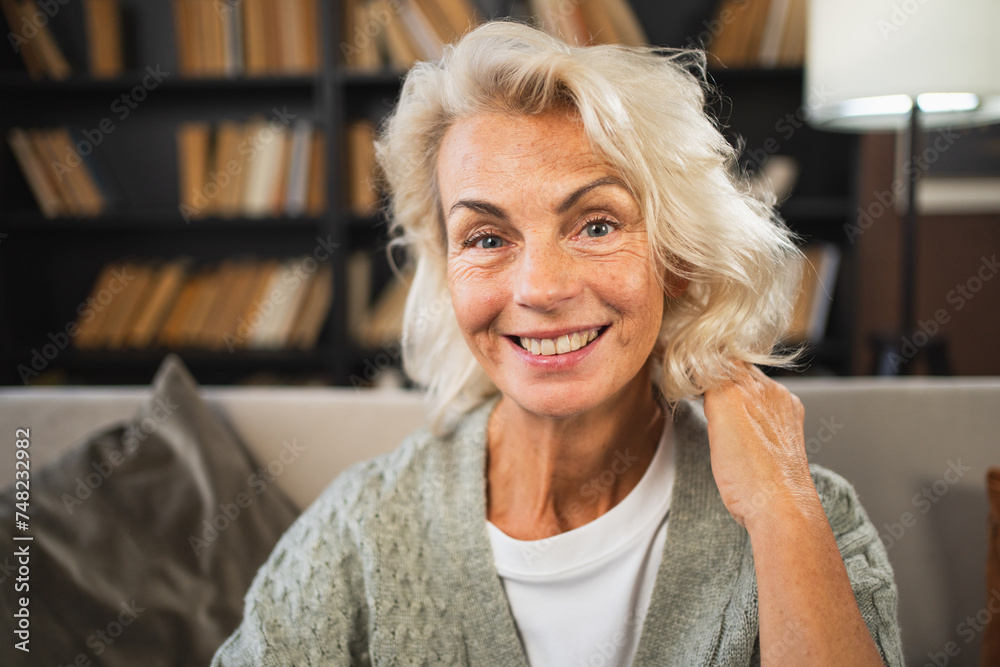 Portrait of confident stylish European middle aged senior woman. Older mature 60s lady smiling at home. Happy attractive senior female looking camera close up face headshot portrait. Happy people Portrait of confident stylish European middle aged senior woman. Older mature 60s lady smiling at home. Happy attractive senior female looking camera close up face headshot portrait. Happy people