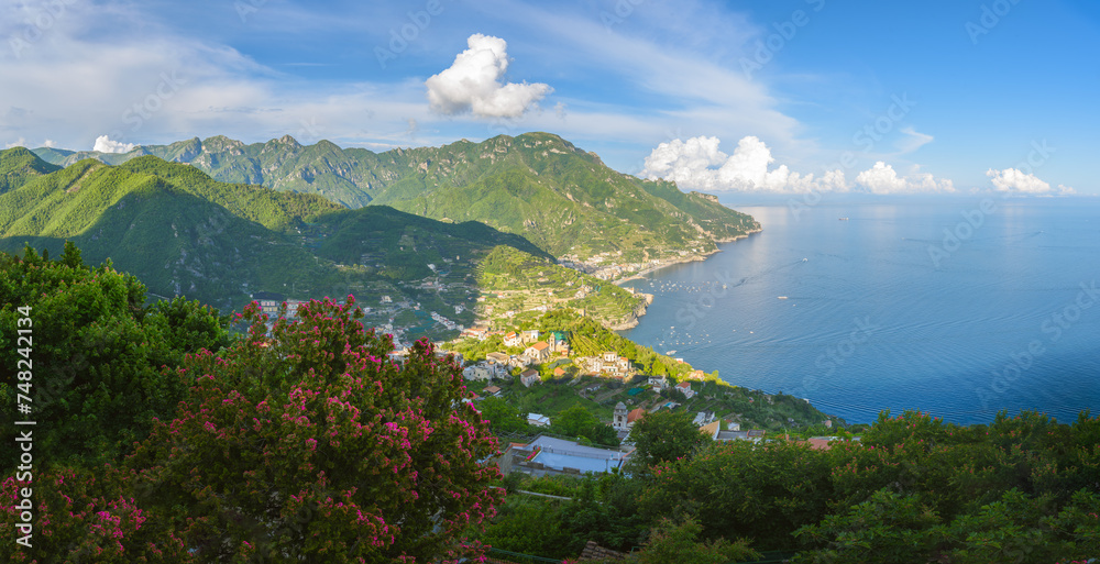 Ravello enchanting vista offers a tranquil retreat above the Amalfi Coast, with lush greenery framing the deep blue of the Mediterranean.