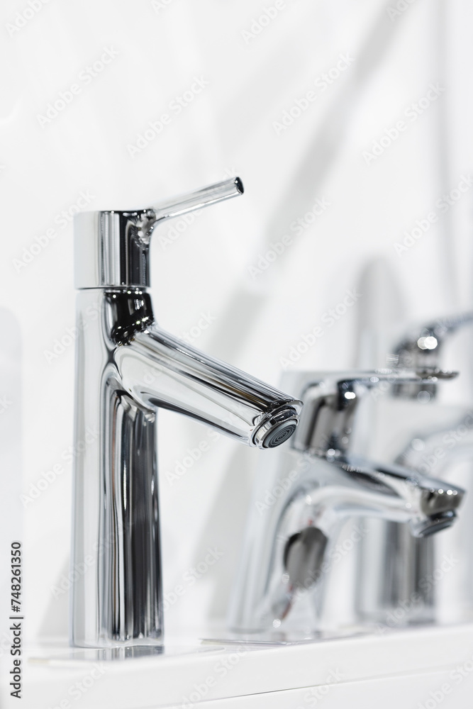 Kitchen water mixer. Washbasin mixer. Water tap made of chrome material. Kitchen water mixer. Washbasin mixer. Water tap made of chrome material.
