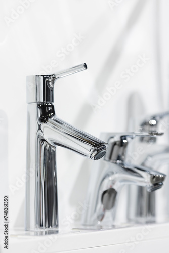 Kitchen water mixer. Washbasin mixer. Water tap made of chrome material.
