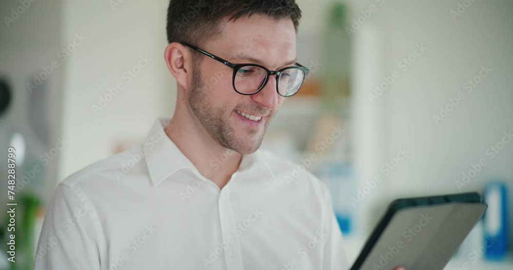 Smiling young male entrepreneur using digital tablet Smiling young male entrepreneur using digital tablet