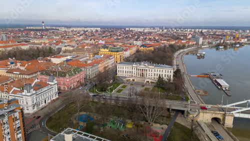 Drone footage from downtown of Szeged, Hungary on a sunny winter day. Szeged, Drone, Aerial, Hungary, Urban Landscape, Szeged Cathedral, Tisza River, Bridge