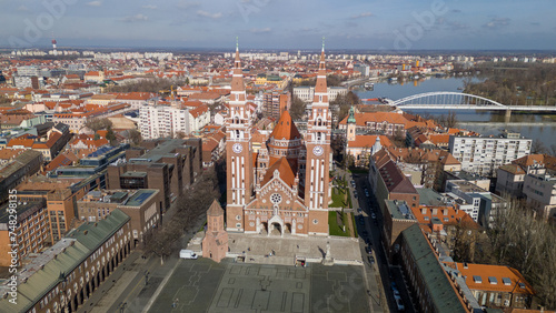 Drone footage from downtown of Szeged  Hungary on a sunny winter day. Szeged  Drone  Aerial  Hungary  Urban Landscape  Szeged Cathedral  Tisza River  Bridge