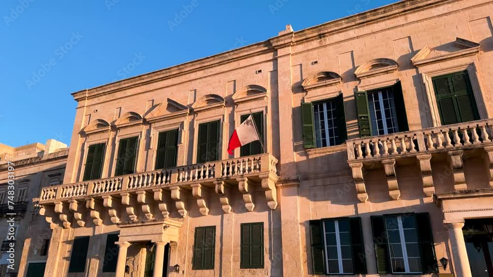 Maltese flag flutters in the wind Maltese flag flutters in the wind
