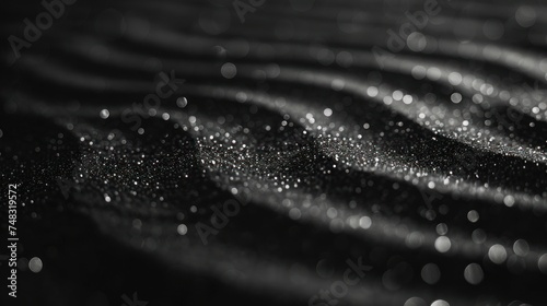 Close-up of black and white water droplets on a surface