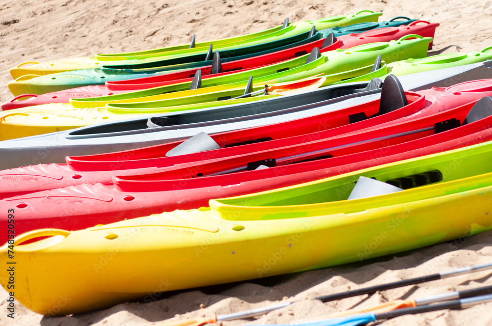multi-colored canoes on the sand multi-colored canoes on the sand