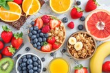 For breakfast, there are many different types of fruits and vegetables on the table, oranges, cereals, muesli, grapefruit, blueberries, strawberries, kiwi, banana
