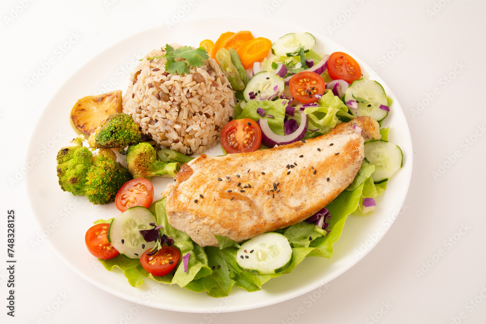 Grilled chicken in a plate with salad and rice isolated clean white background top view photo Grilled chicken in a plate with salad and rice isolated clean white background top view photo