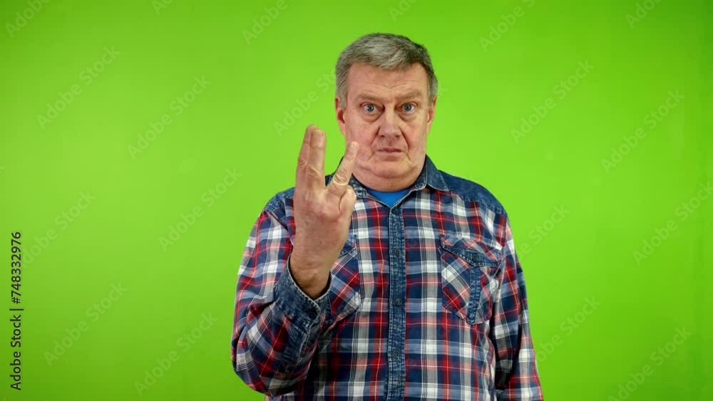Senior man counting from one to four with fingers. Senior man counting from one to four with fingers.