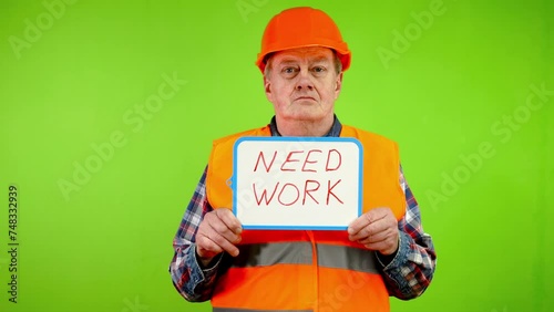 Worker holds in hands inscription need work. photo