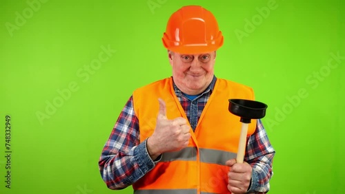Plumber shows his tool plunger, choose me, I best. photo