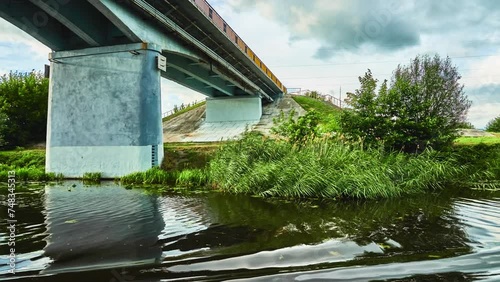 Old bridge in the city of Kobrin, Belarus. Mukhavets is a river in western Belarus, a tributary to the Bug River. photo