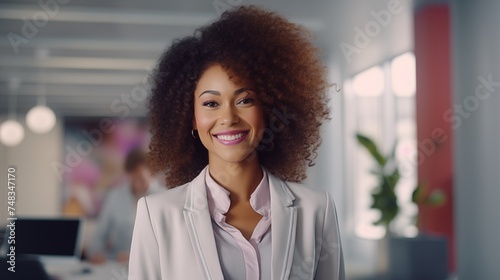 portrait of black female manager smiling in office