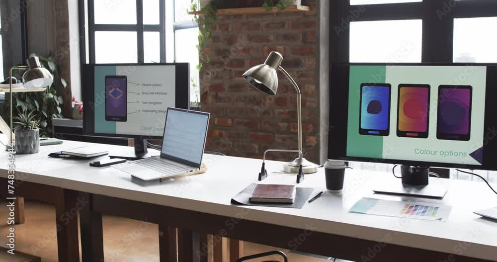 Modern business workspace is equipped with multiple monitors, a laptop, and various office supplies Modern business workspace is equipped with multiple monitors, a laptop, and various office supplies