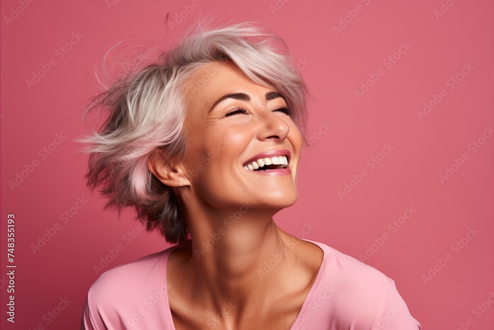 Portrait of a beautiful smiling woman with blond hair on pink background Portrait of a beautiful smiling woman with blond hair on pink background