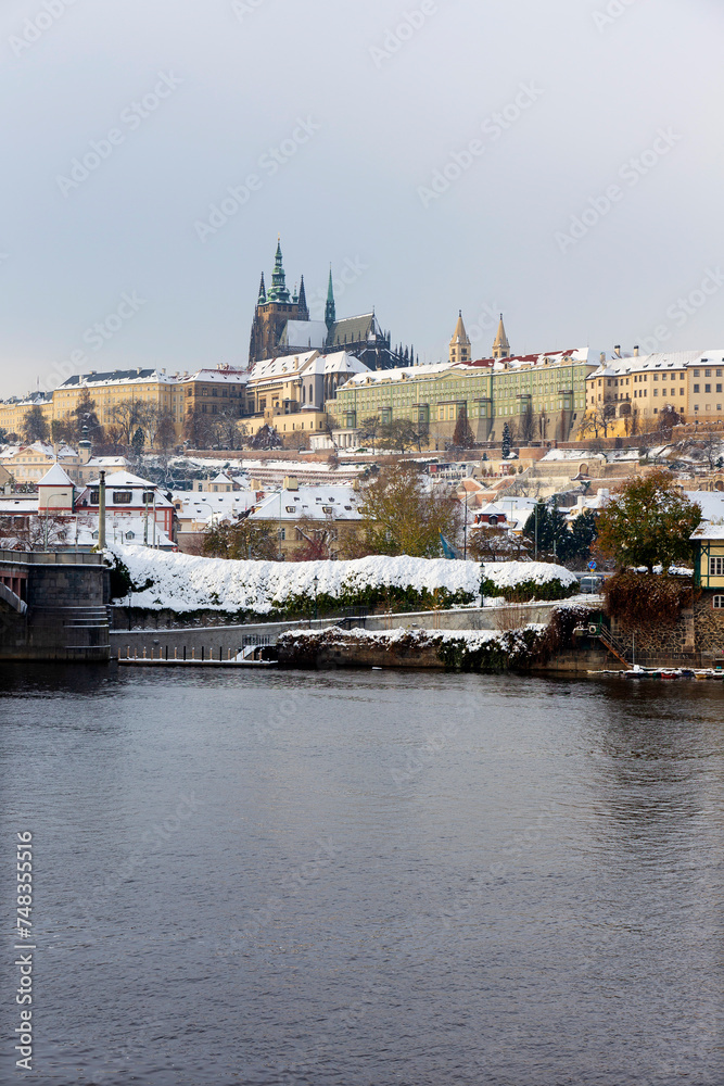 Snowy Prague City with gothic Castle in the sunny Day, Czech Republic
