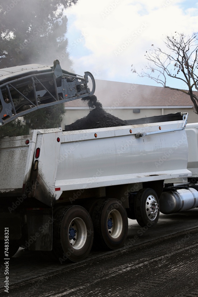 Fototapeta premium asphalt milling machine grinds up the old layer