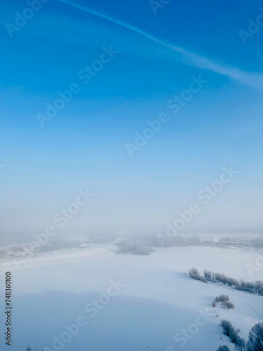 Winter white foggy landscape of a frozen city in Siberia © Margarita Mao