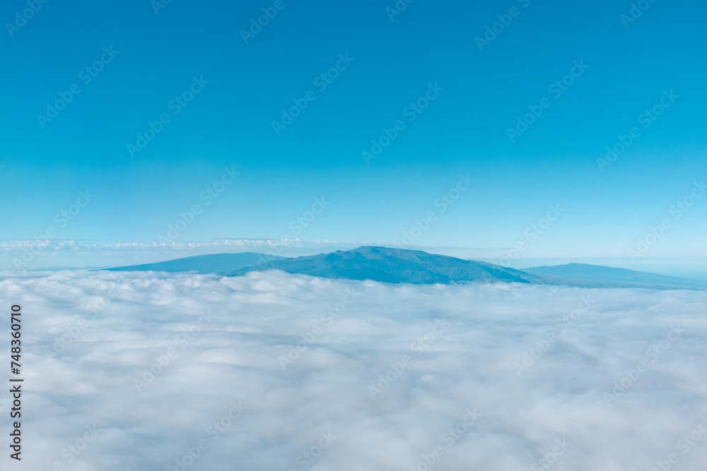 Aerial photography of Honolulu to Hilo from the plane. From left to right: Mauna Kea, Mauna Loa, and Hualalai. Hawaii island
Aerial photography of Honolulu to Hilo from the plane. From left to right: Mauna Kea, Mauna Loa, and Hualalai. Hawaii island