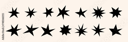Different stars and sparkles. Hand drawn  doodle abstract elements isolated on a white background. Black modern trendy shapes. Vector illustration