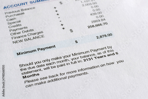 Credit card statement with minimum payment warning explaying how long it will take to pay off debt