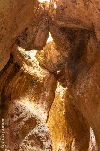 Karadakh gorge. Sunlight in a mountain Canyon. Beautiful curved crevice in sunny weather. Creation erosion of yellow sandstone by water acquired twisted shape natural Origin. Dagestan, Russia, Europe
