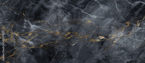 A high resolution Italian dark gray marble texture featuring gold accents, ideal for interior and exterior home decoration as well as ceramic wall and floor tiles.