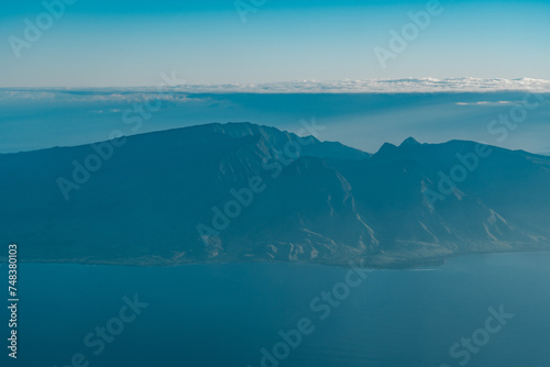 The West Maui Mountains  West Maui Volcano  or Mauna Kah  l  wai which means  holding house of water  is approximately 1.7 million years old and forms a much eroded shield volcano.