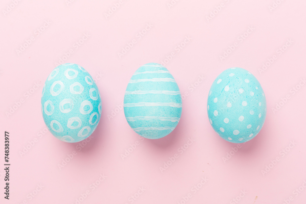 Fototapeta premium Blue easter eggs on color background, top view