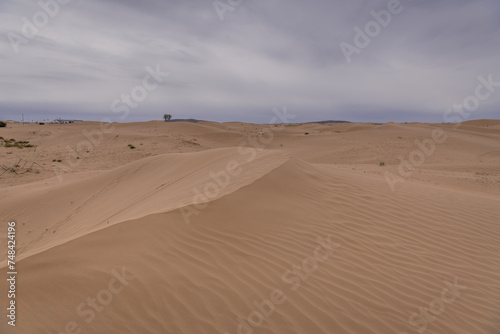 Sunset view of Sand dunes in XiangshaWan, or Singing sand Bay, China