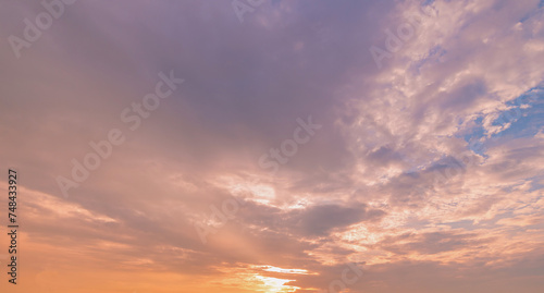Fototapeta Naklejka Na Ścianę i Meble -  Panoramic view of sunset golden and blue sky nature background.
Colorful dramatic sky with cloud at sunset.Sky background.Sky with clouds at sunset.