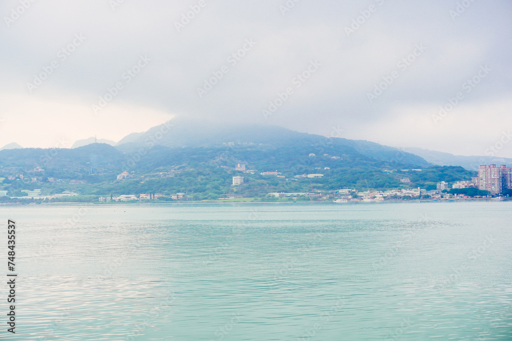 Taipei, Taiwan, Republic of China, 01 22 2024: Clean Tamsui river in a raining day in winter
